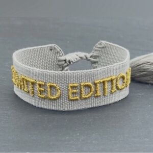 NWOT Unisex Limited Edition Gray Bracelet with Gold Embroidery
